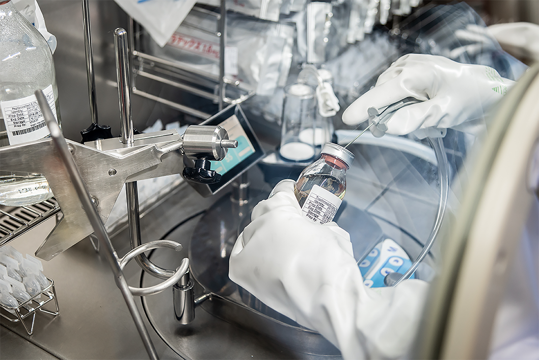 Gloved hands working in laboratory environment Gloved hands working in laboratory environment